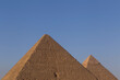 Great pyramid and pyramid of Khafre in Giza against clear blue sky