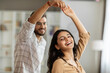 © Home-stock - Romantic indian spouses dancing, enjoying time together and having domestic date at home on weekend. Successful marriage, love and romantic relationship concept