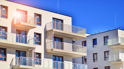 Modern luxury residential building. Modern apartment building on a sunny day. Facade apartment building  with a blue sky. 