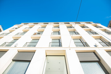 Wall Mural - Looking up the facade of a modern apartment building.