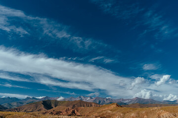 Fototapete - Picturesque landscape with mountain peaks and blue sky