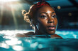 Portrait of a black woman swimming in a sports pool.