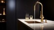 Interior of modern minimalist bathroom with white marble countertop and built-in wash basin, golden faucet and bottles with cosmetics. Black matte wall with shelves on the background. Close up.