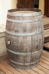 Poster - Traditional wooden barrel on street outdoors. Wine making