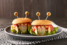 Cute Monster Burgers On Table. Halloween Party Food