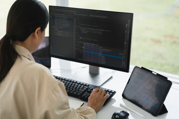 Wall Mural - developer programmer typing code on keyboard for programming to developing web and application
