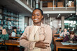 © Marko Geber - Smiling portrait of a happy african american female student in a college or university library