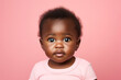Studio portrait of cute little baby infant smiling on different colours background