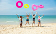© NVB Stocker - Jumping. Group of teenager girls jump on the beach. Four teenager girl female enjoying on inflatable ring and dance on tropical beach. Vacation trip summer holiday. Gen Z