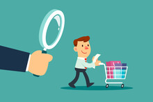 Big Hand With Magnifying Glass Looking At Businessman With Shopping Cart