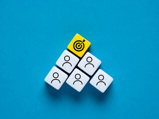 Wall Mural - teamwork and achieving corporate business goals concept. employee and target goal symbols on colorfu