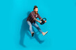 © deagreez - Full length photo of astonished man dressed plaid shirt pants hold steering wheel staring at accident isolated on blue color background