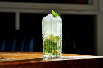 Wall Mural - Mojito alcoholic cocktail with lime and mint