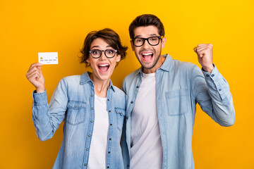 Sticker - Photo of two business people hold credit card raise fist up enjoy deposit income profit isolated shine color background