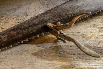 Wall Mural - Repair of an old saw. Old rusty tools.