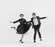 © master1305 - Black and white. Happy, positive, smiling young people, man and woman in elegant clothes dancing lindy hop. Concept of hobby, retro dance, vintage style, choreography, beauty. Monochrome art. Ad