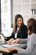 © Nuttapong punna - Two businesswoman discuss investment project working and planning strategy with tablet laptop computer in office..