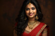 beautiful indian woman in saree and jewelry smiling
