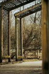 Poster - A vertical shot of wooden frames at the park