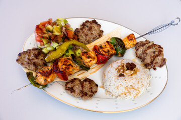 Poster - Closeup of Turkish food, barbecue meat skewers, and eggplant cream with sesame sauce