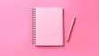 © Yuwarin - A notebooks on pink background.