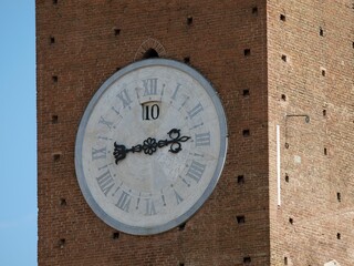 Poster - Closeup shot of the clock on the historic Torre del Mangia tower in Siena, Italy