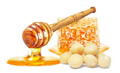 Wall Mural - dripping honey, honeycomb and macadamia nuts isolated on white background