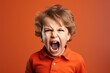© Stavros - Angry irritated boy. Full of rage. Emotional portrait of an upset preteen boy screaming in anger. Requirements for parents. Wrong perception. Hysterics.