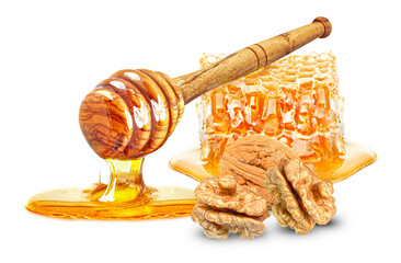 Wall Mural - dripping honey, honeycomb and walnuts isolated on white background