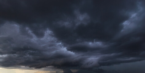 Aufkleber - Bad or moody weather sky and environment.The dark sky with heavy clouds converging and a violent storm before the rain.carbon dioxide emissions, greenhouse effect, global warming, climate change