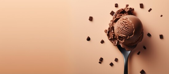 Poster - Chocolate ice cream served in a metal scoop on a isolated pastel background Copy space