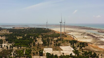 Wall Mural - Aerial view of Wind turbines for electric power production on the seashore. Wind power plant. Ecological landscape. Jaffna, Sri Lanka.