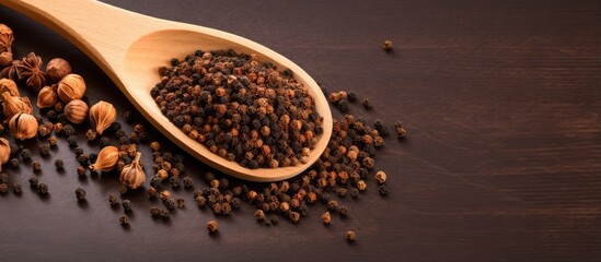 Leinwandbilder - Copy space with isolated wooden spoon filled with dried aromatic pepper spices