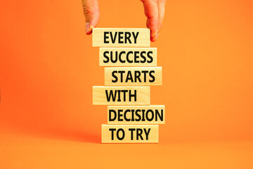 Wall Mural - Success symbol. Concept words Every success starts with decision to try on wooden block. Beautiful orange table background. Businessman hand. Business success and decision to try concept. Copy space.