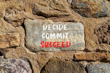 Wall Mural - Decide commit succeed symbol. Concept word Decide Commit Succeed on beautiful big stone. Stone wall. Beautiful stone wall background. Business decide commit succeed concept. Copy space.