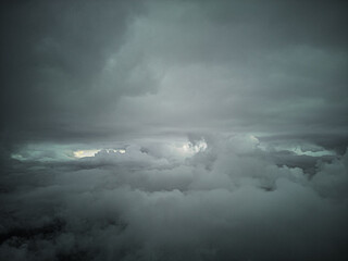 Between two layers of clouds.