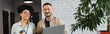 © LIGHTFIELD STUDIOS - happy african american businesswoman and asian man with laptop, diverse office workers, banner