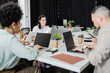 © LIGHTFIELD STUDIOS - busy hours in modern coworking, multicultural team working on startup project and using devices