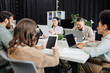 © LIGHTFIELD STUDIOS - busy hours in modern coworking, interracial team working on startup project and using devices