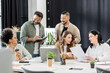 © LIGHTFIELD STUDIOS - multiethnic business team generating ideas and discussing project in coworking, group of people