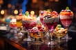 desserts are arranged in glasses on a table