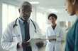 © Jan - Doctor with a medical report talking to a nurse in hospital