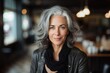 Happy mature gray haired woman face portrait. Beautiful mid age caucasian woman model, blurred restaurant background. Aged lady lifestyle, generated by AI