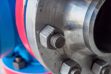 Close-up of steel pipe connection with bolts. Part of gas equipment. Gas industry. Background.