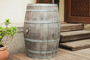 Poster - Traditional wooden barrel on street outdoors. Wine making