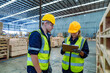 © AU USAnakul+ - Factory engineer staff worker operate machine and hard hat working holding clipboard checking quality of wooden at production line. Production line of the wooden working industrial factory