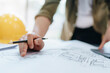 © Jirapong - engineering department with work design structure building or house using blueprint computer at working.