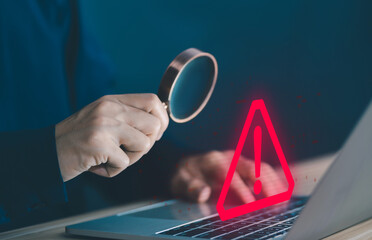 Wall Mural - laptop shows a warning sign of system failure. concept notification a spam, risk of website technolo