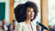 © Tierney - Happy african american businesswoman giving a speech at conference