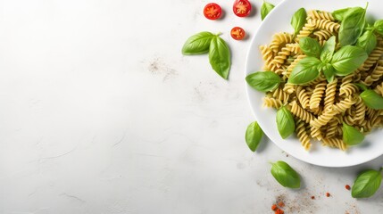 Wall Mural - Delicious pasta with pesto sauce and basil on light table background,Flat lay 